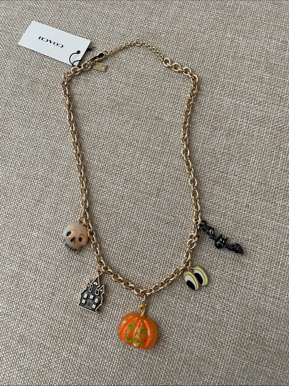Coach Gold-Tone Halloween Charm Necklace with Orange Pumpkin & Skull Charms